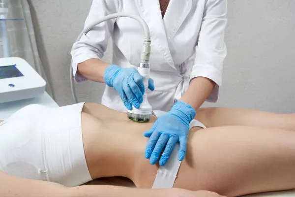 Lost the Weight but Not the Loose Skin? 2 woman having HIFU treatment on her stomach to combat loose skin Groby following weight loss